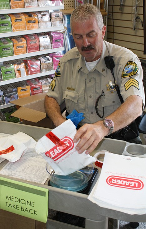 Sgt. Vierthaler receiving prescription drugs and personal care products at Ray's Pharmacy.