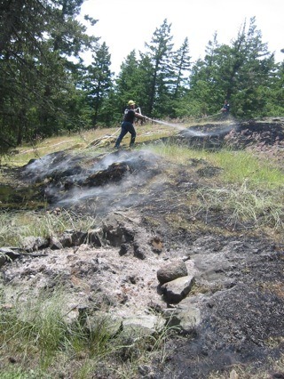 A burn pile near Orcas on May 25
