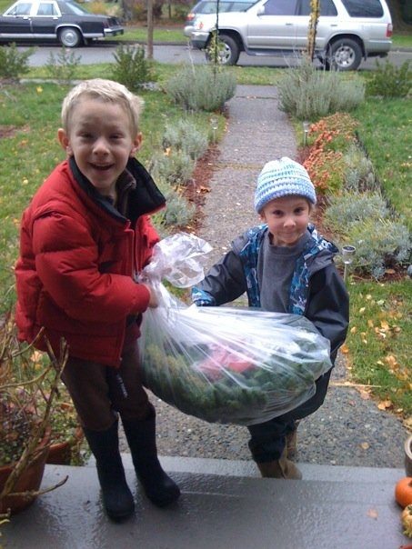 Trevor Moulton and Finnian Rubottom carry one of the wreaths the school is selling.