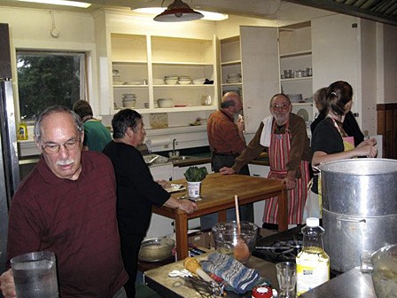 Bill and Monique Gincig (forefront and far left) and other volunteers at last year's community Thanksgiving dinner.