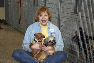 Marsha Waunch with two of the rescued dogs at the Orcas Shelter.