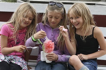 Orcas Island friends share a shaved ice treat.