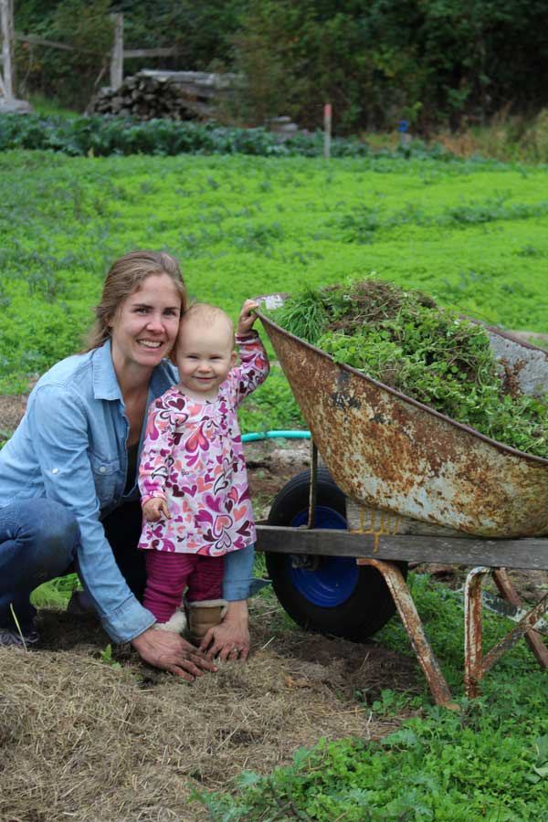 Victoria Shaner and her daughter Cora in the community garden.
