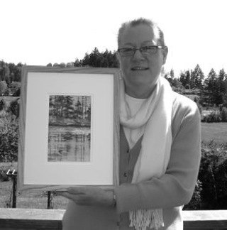 Jacqueline Kempfer displays her painting of Mountain Lake.