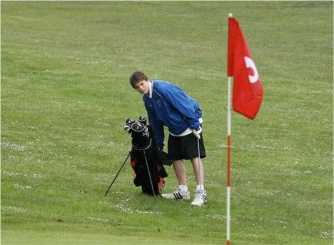A Viking golfer sizes up the green.