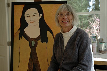 Betsy Nelson with one of her paintings.