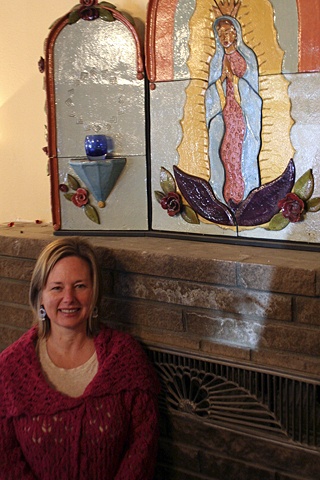 Karen Campbell with an altar by Kat Taylor that survived the fire.