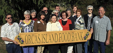 Orcas Food Bank volunteers who help twice a week with the operation out of the community church basement. Front row: President Larry Shaw