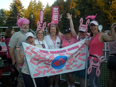 Island Girls and Guys with the banner they carried to honor those on Orcas diagnosed with breast cancer.
