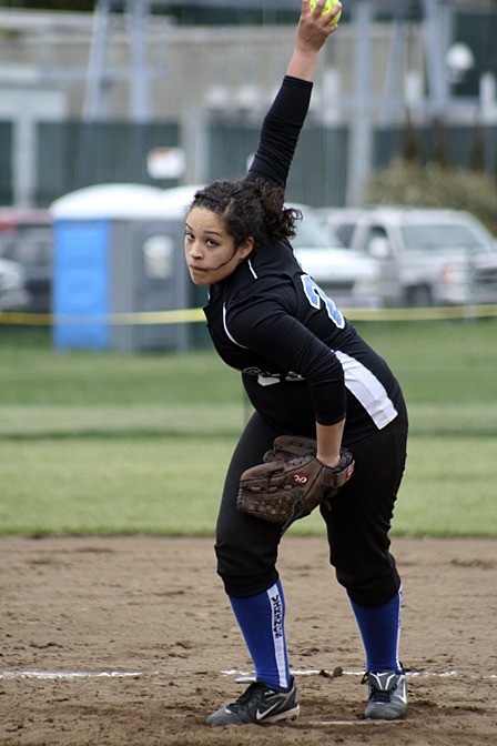 Pitcher Adria Garcia winds up to send a fast one across the plate
