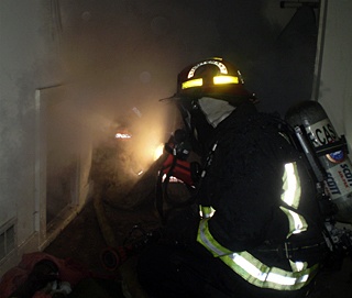 Fire Lt. Jeff Jones and Firefighter Robin Dyer located and knocked down the first of several stubborn fires burning in the crawl space of a residential fire early Monday morning.