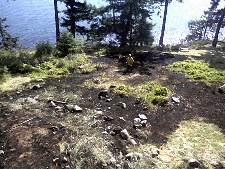 Lt. Jeff Jones is standing at the fire ring