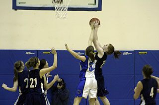 A Lady Viking thwarts a Lady Crusader at the field goal.