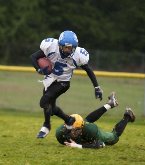 Tyler Nigretto (5) Shaking a tackle from a Darrington Linebacker on his way to a first down.