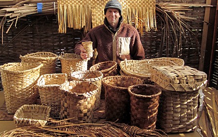 Kurt Thorson with some of his decorative weavings and plaited baskets.