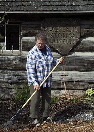 Spring landscaping at museum - Jean Dickerson was one of a group of volunteers who helped spruce up the Orcas Historical Museum grounds on April 17 and 18. Dickerson says they are also in need of old plants from island homesteads to transplant.
