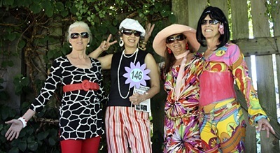 Orcas Center volunteers showing off some of the stylish clothes they'll be wearing the night of the event. From left to right: Sukima Hampton