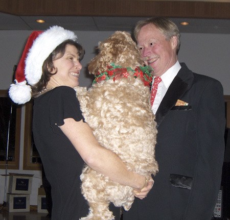 Betsy Greacen and Dr. David Shinstrom with Paqo the dog during the dinner and dance last year.