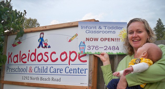 Director Amber Paulsen with the new Kaleidoscope signs.