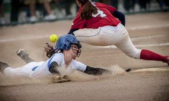 Viking Huxley Smart (3) stealing second base during the state softball play-offs.