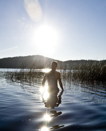 A visitor soaks up some rays of vitamin D at Cascade Lake.