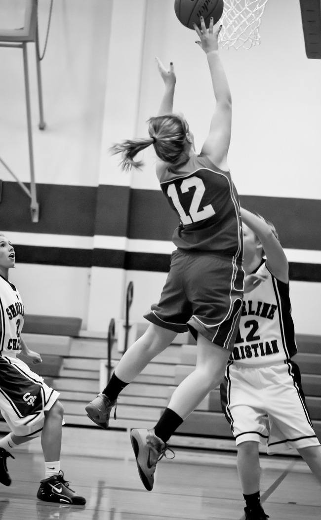 Viking Shelbi Rogers (12) with a lay-up after poaching the ball from a Shoreline point guard.