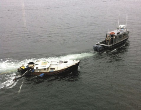 The boat being towed by a Fish and Wildlife boat.