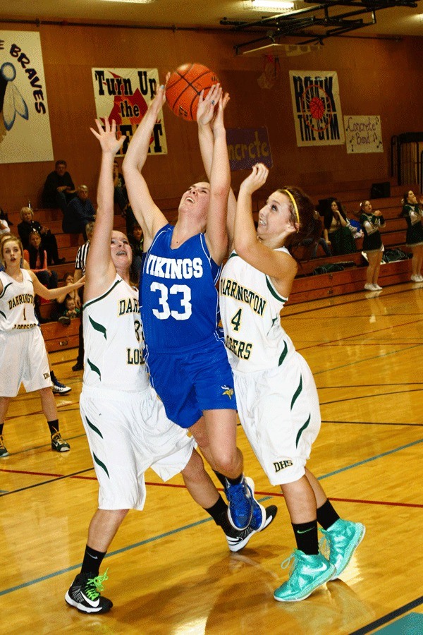 Hannah Gaydos struggles to keep the ball during a shot.