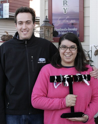 Jake Griffith helps Crystal Taylor make jewelry for her new business “Designs by Crystal.” Her work is at Jillery and the holiday festival of arts.