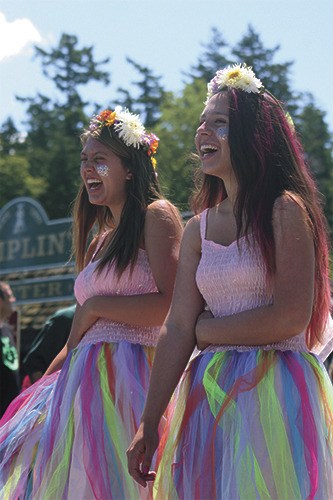 Zonia Darnall (left) and Ariahna Tidrington (right) share a laugh during the parade.