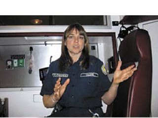 Valerie Harris shows off the new ambulance.