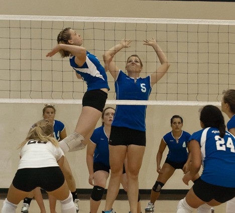 Emily Bodenhamer smashes one over the net.