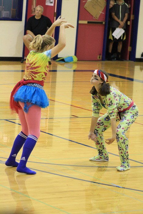 Two freshman play the bear-gorilla-duck game at the assembly.