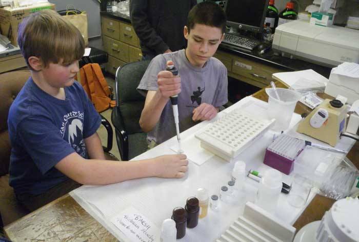 Two members of the science club working on a study last year.