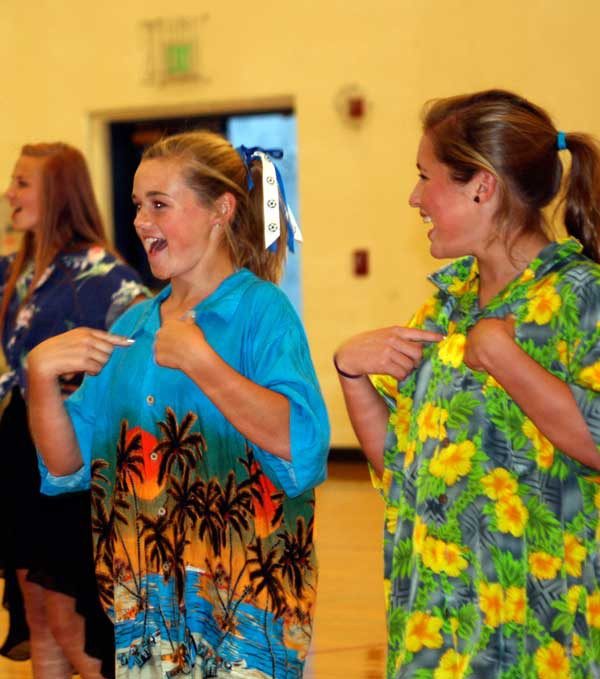 Freshman Emma Minnis and Bethany Menach performing during the homecoming assembly.