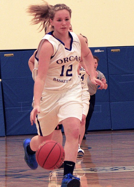 Viking Shelbi Rogers drives the ball down the court during the game against the Crusaders.