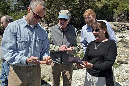 Molly Bailey pictured with SeaDoc board member Grant kirby (in background on left)