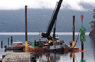 DNR removing creosote from Judd Cove last week.