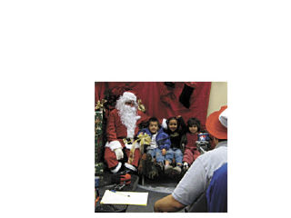 Dave Mowrey of the Country Corner took pictures of about 30 people who came to visit Mr. Claus – kids of all ages