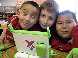 Happy kids with an XO laptop.