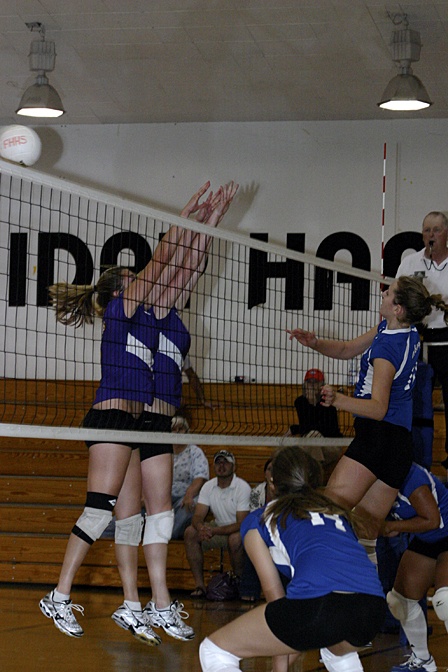 Vikings April Hofman smacks a winner over the outstretched arms of Friday Harbor's defenders in the Vikings victory   Tuesday on the road at Friday Harbor.