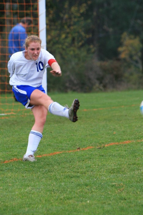 Co-captain Ashley Klein boots the ball upfield in a later game.