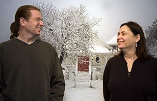 Martin and Marcia Taylor share a joke in front of Martin’s “Red Door” photograph.