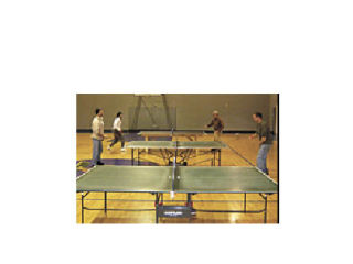 Happy ping pong players at a recent table tennis game night.
