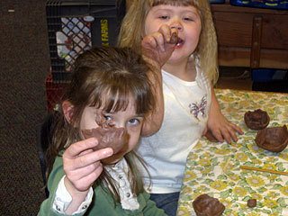 Elementary kids creating masterpieces.