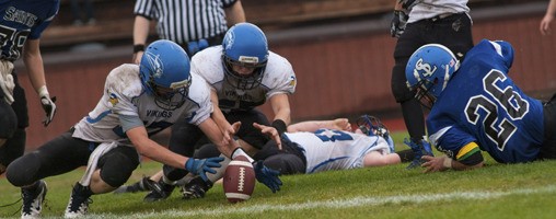 Two Vikings go for the ball during the game against the Seattle Lutheran Saints.
