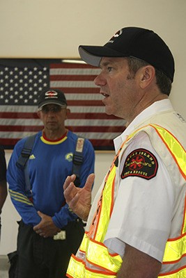 Chief Kevin O’Brien (right) discussing how the drill went. Firefighter Dennis Dahl is in the background.