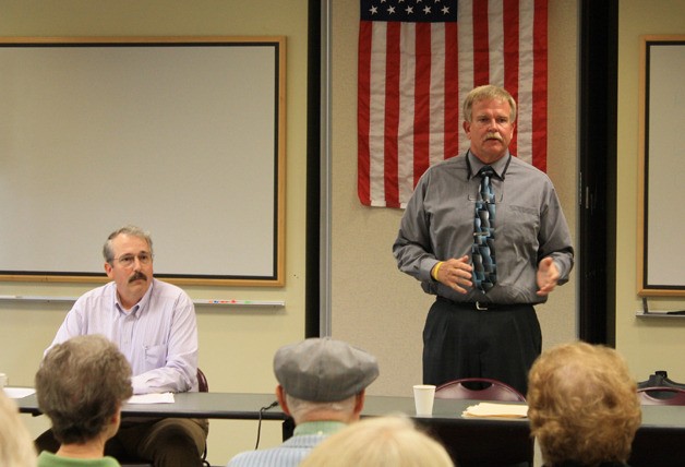 Brent Johnson waits his turn while Rob Nou speaks at the forum.