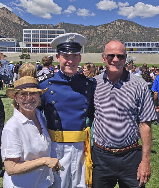Parker Quinn with parents Jeff and Mary Mudd Quinn.