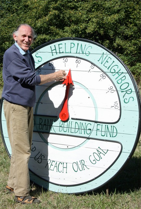 Food bank board member George Post moves the dial to $55